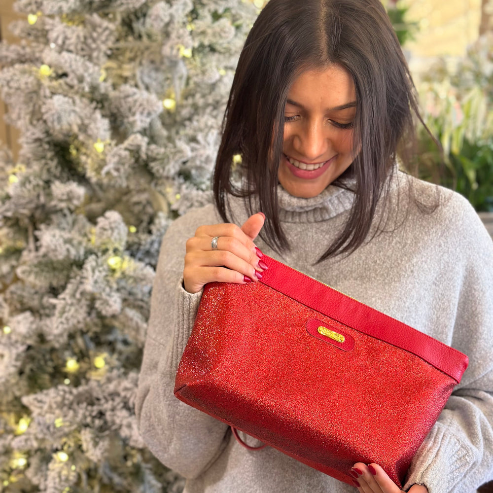 
                      
                        Pochette in tessuto ELLY rosso lurex
                      
                    