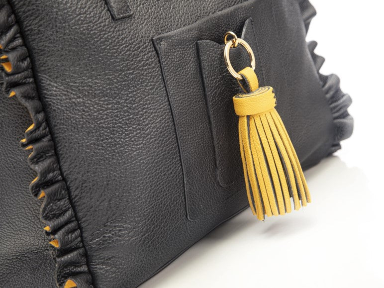 
                      
                        Borsa in pelle MARY con frappe giallo
                      
                    