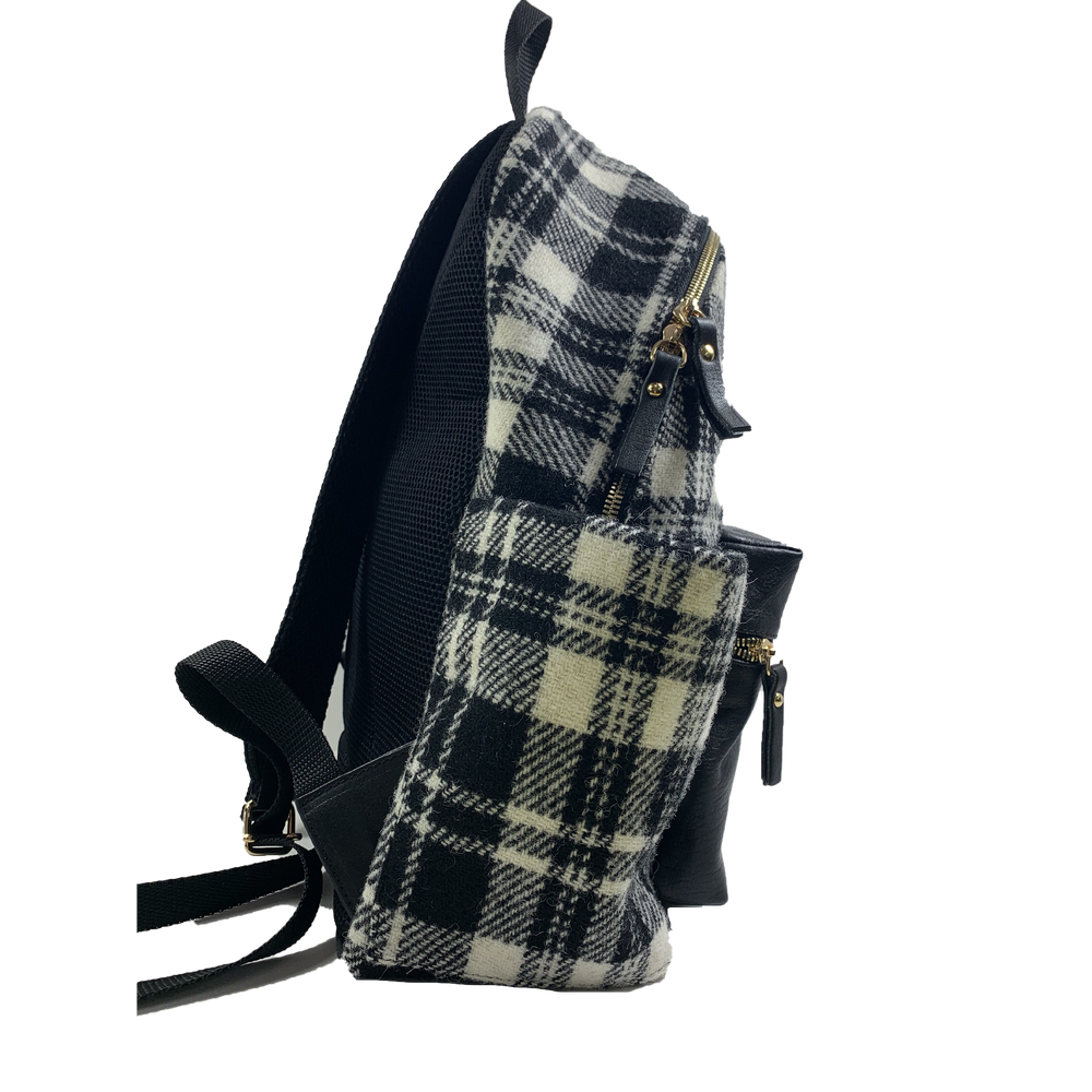 
                      
                        Zaino in tessuto tecnico DANTE tartan
                      
                    